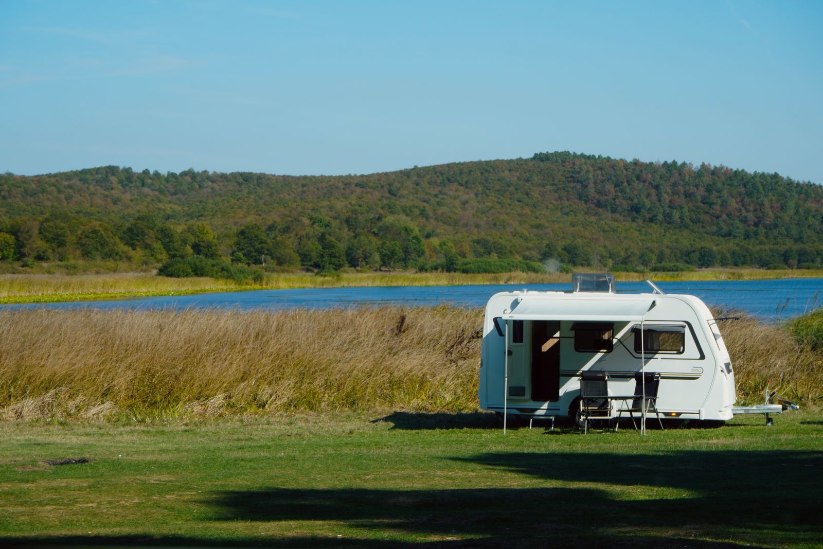 Caravan camping beside a lake